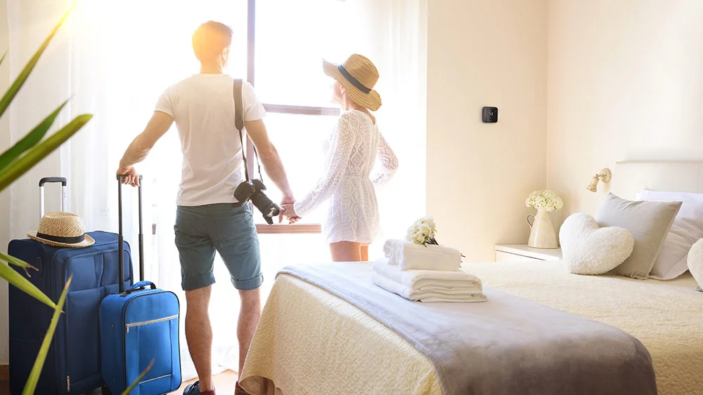 family standing in a vacation rental room