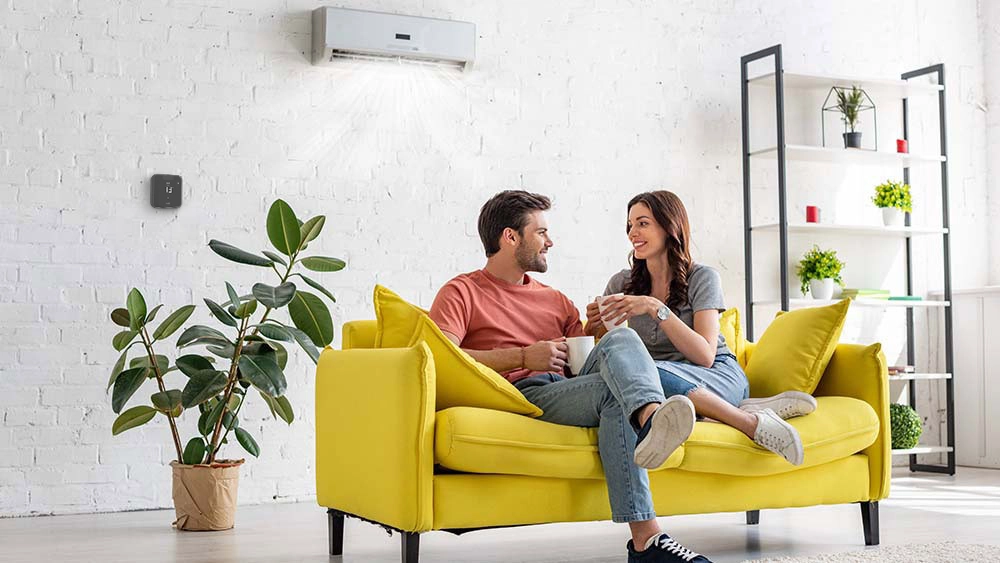 couple enjoying evening tea while breez max maintains ideal home temperature 