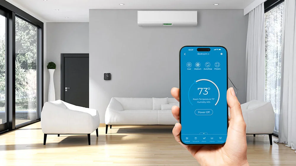 Cielo Breez Max connected with a mini-split. A woman is using Cielo home app to control the room temperature.