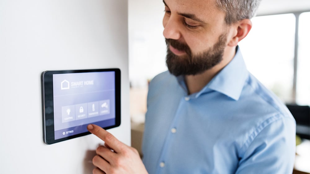 Man turning on the thermostat