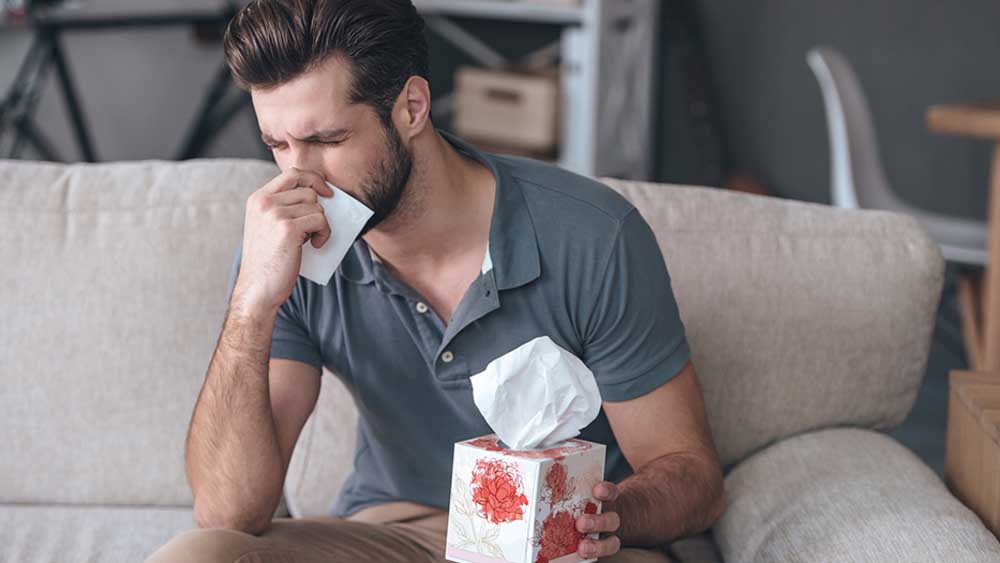 A man having allergy symptoms