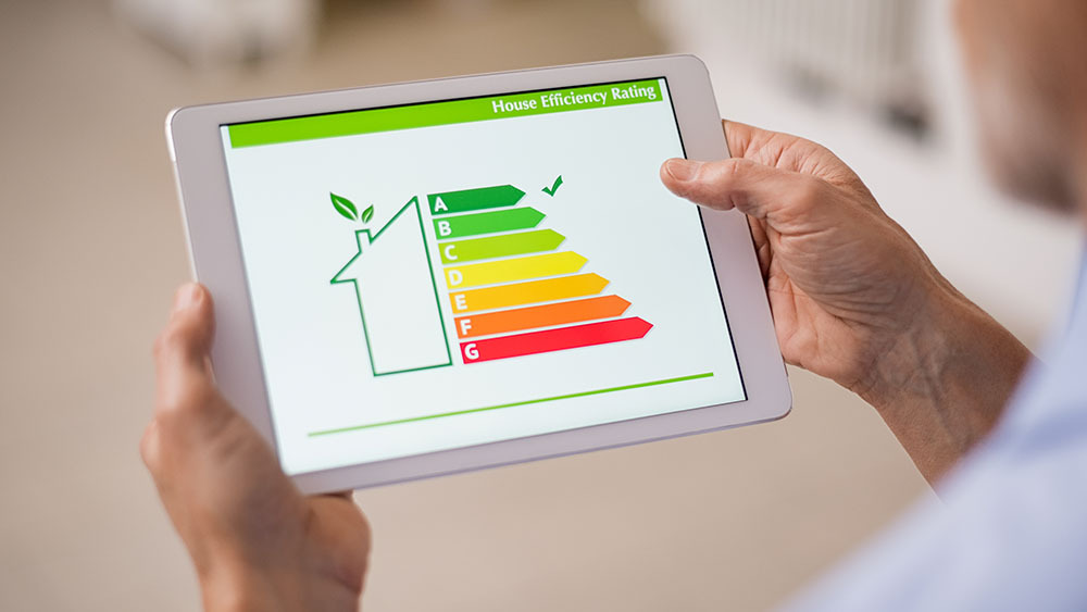 A man is measuring home efficiency ratings