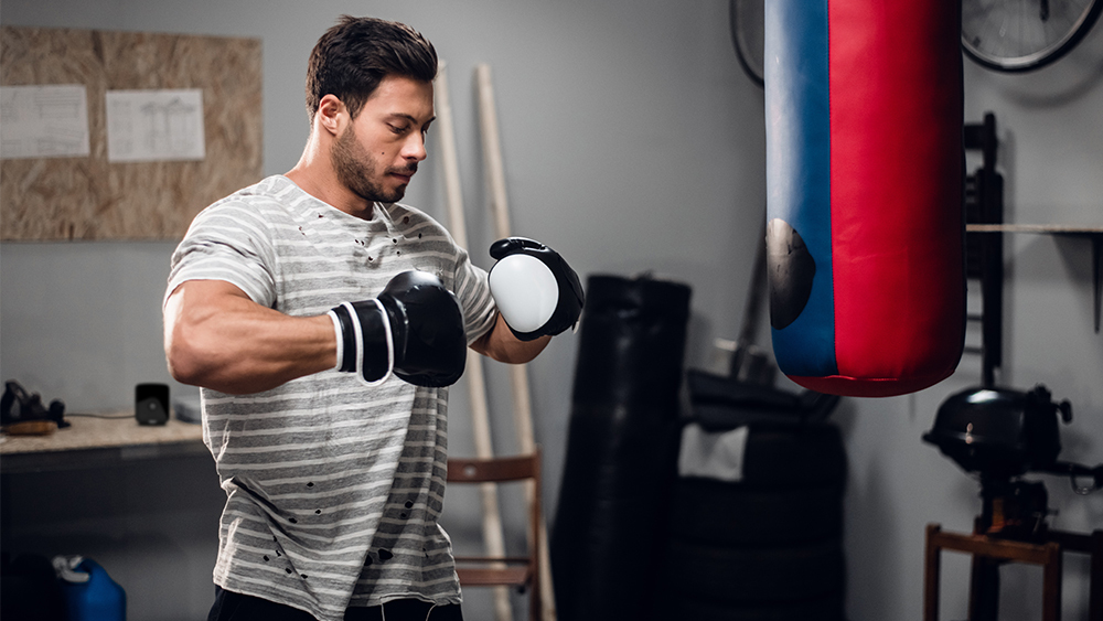 A man warming up before a boxing session