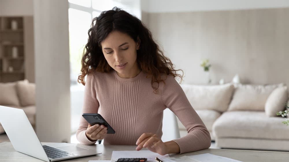 Woman calculating bills