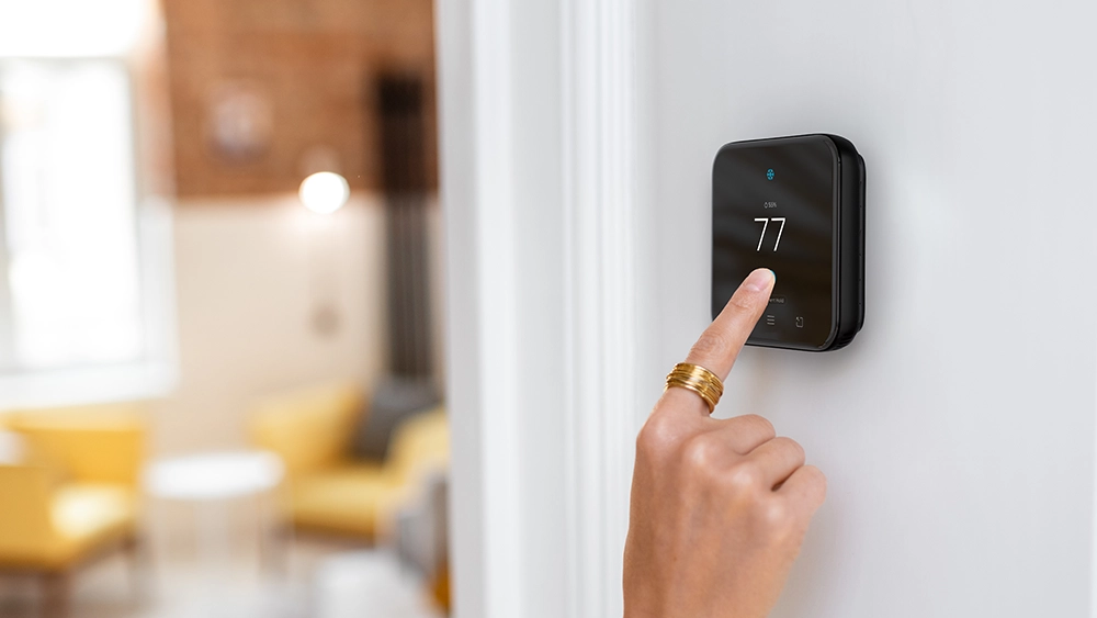 A person using cielo smart thermostat 