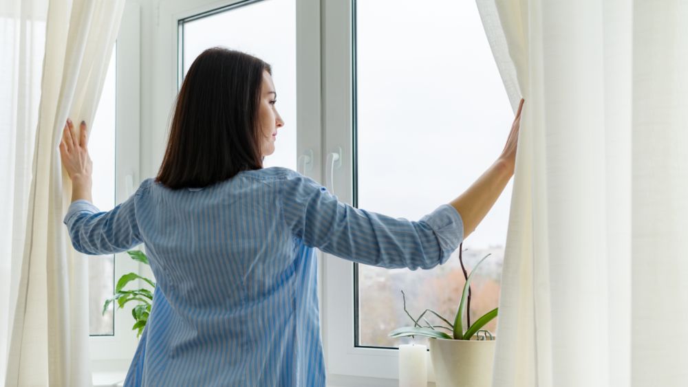 woman looking out of the window