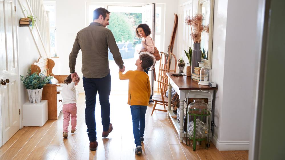 A family of four leaving home as they head out on a vacation