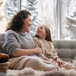 Mother and daughter enjoying a cozy comfortable environment with an ideal indoor humidity in winter