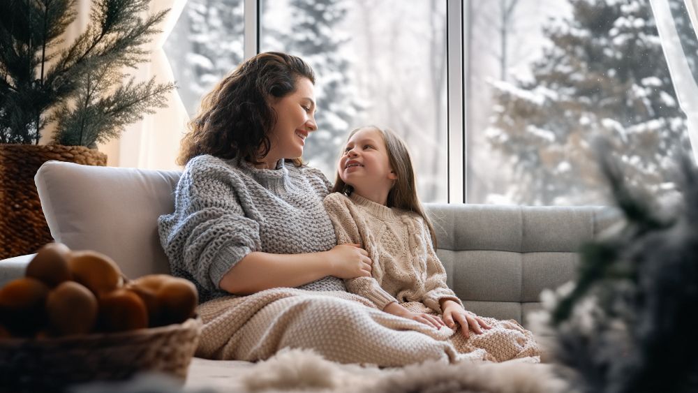 Mother and daughter enjoying a cozy comfortable environment with an ideal indoor humidity in winter