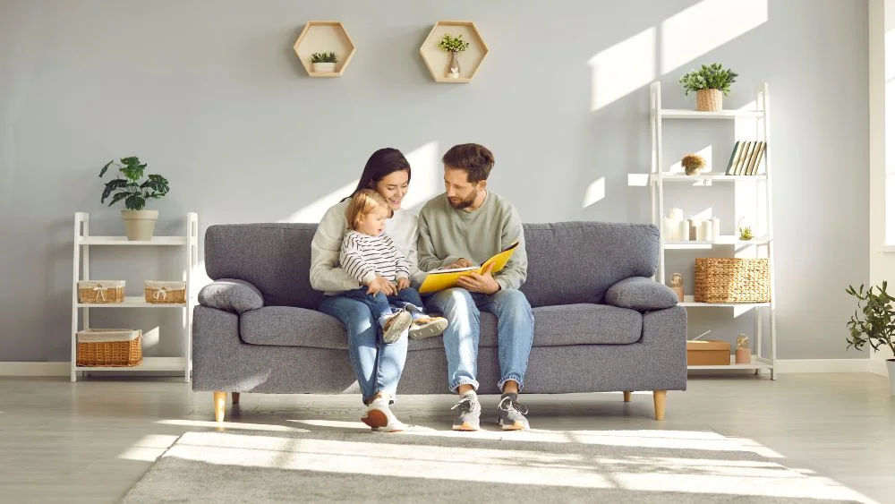 a family happily sitting in the living room relaxing