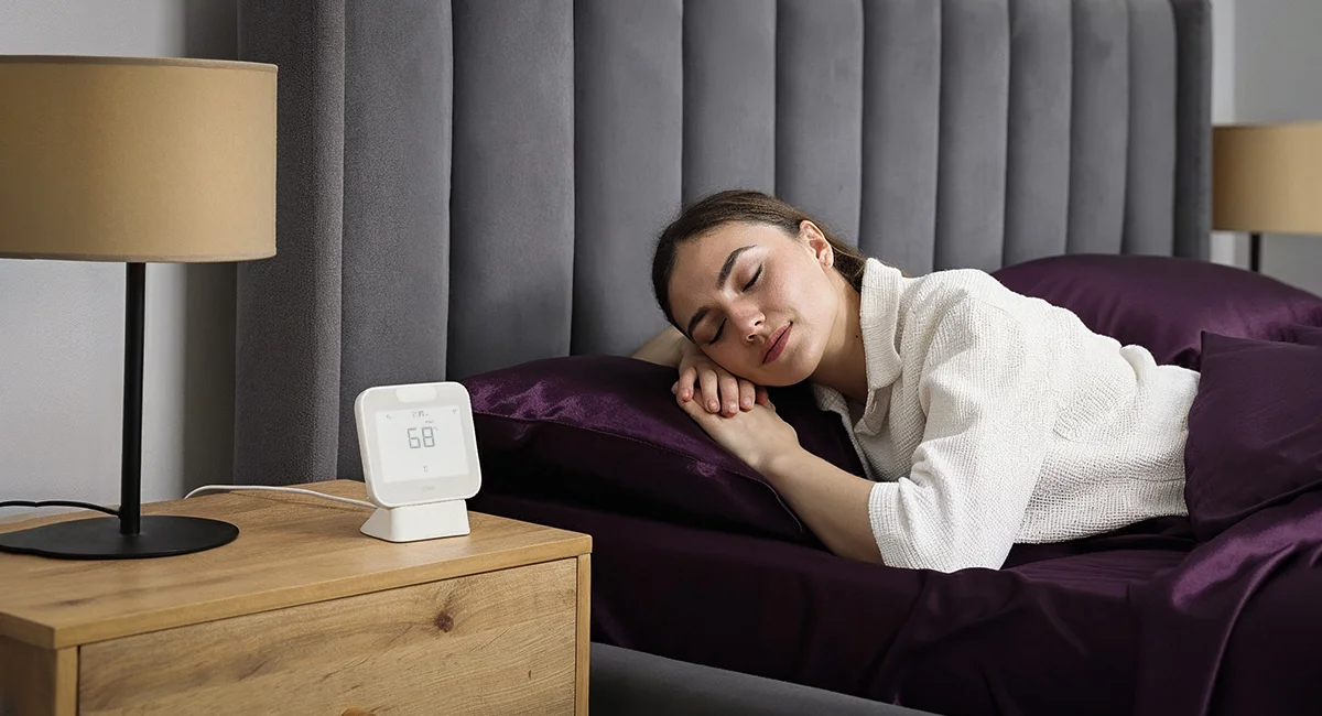 woman sleeping restfully. Cielo Breez Max maintaining ideal climate for sleep.