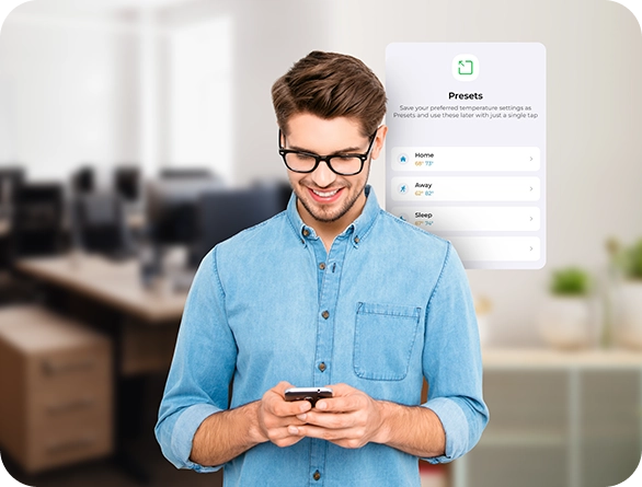A man using Cielo smart thermostat presets on Cielo home app.
