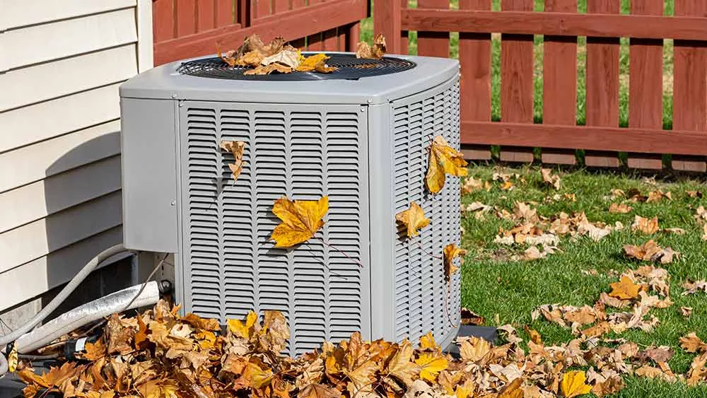 Heat pump outdoor unit maintenance in fall 