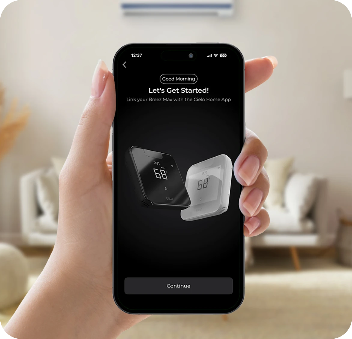 A man holding a phone with the Cielo Home app device setup