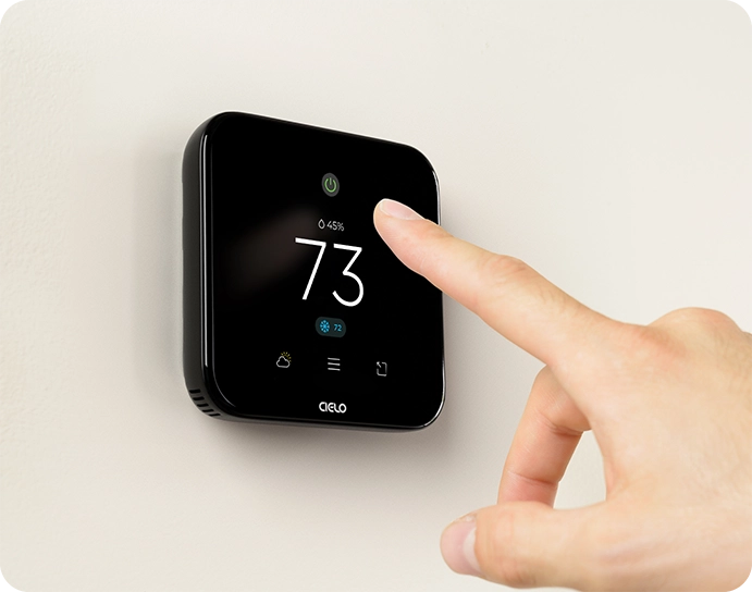 A person pointing at breez edge device